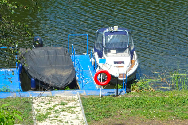 River and a pleasure boat on the pier. Nature background