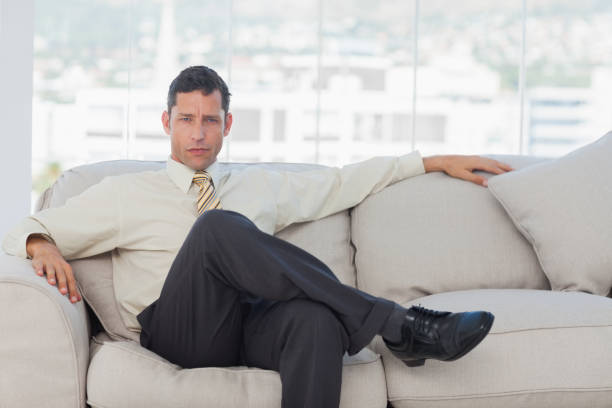 istock Serious businessman posing sitting on sofa 835961280