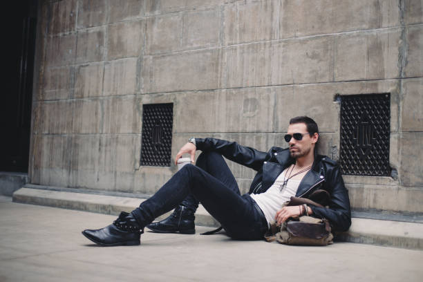 istock Hipster man lying on the street 835961986