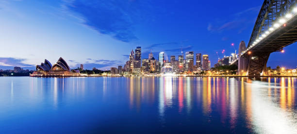 sydney skyline and harbor bridge during sunrise, new south wales australia - international landmark sydney harbor australia new south wales imagens e fotografias de stock