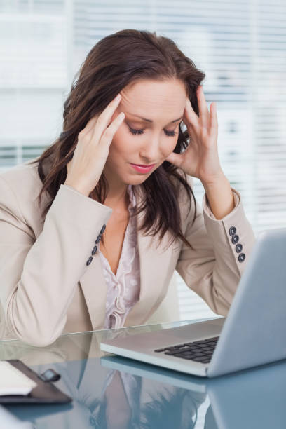 istock Tired businesswoman having a headache 835968246