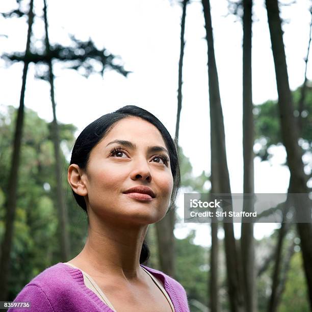 Woman In Forest Looking Up Portrait Stock Photo - Download Image Now - One Woman Only, Happiness, Headshot