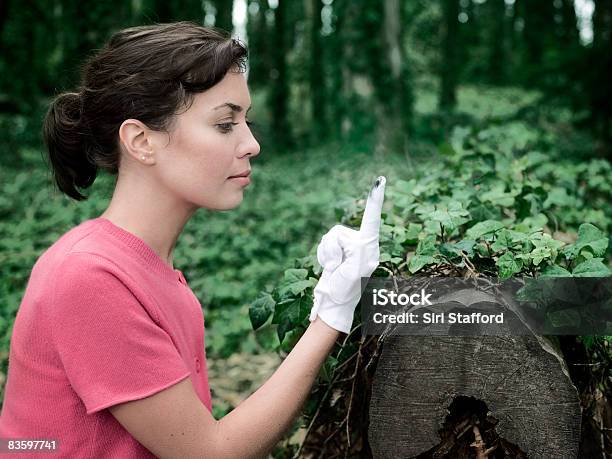 Woman In Forest Looking At Dirty White Glove Stock Photo - Download Image Now - Research, Forest, Ivy