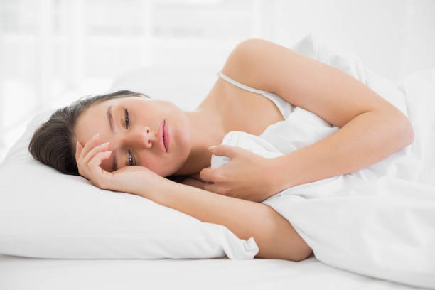istock Woman sleeping in bed 835987294
