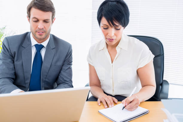 istock Smartly dressed colleagues in business meeting 835988046