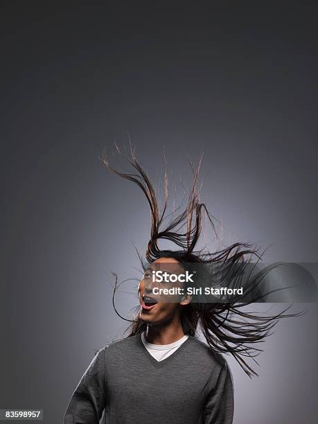 Man With Long Hair Blowing In Wind Stock Photo - Download Image Now - Tousled Hair, Wind, Long Hair