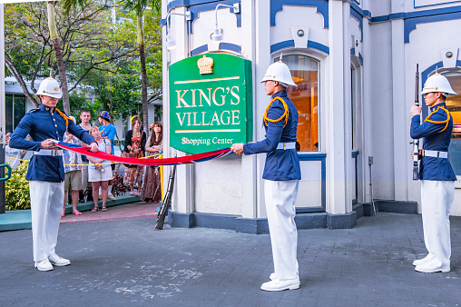 Waikiki, HI, USA - March 23, 2012: Guard soldiers are performing for tourists in King's Village of Waikiki.  King's Village has numerous gift shops and restaurants for tourists looking for gifts.