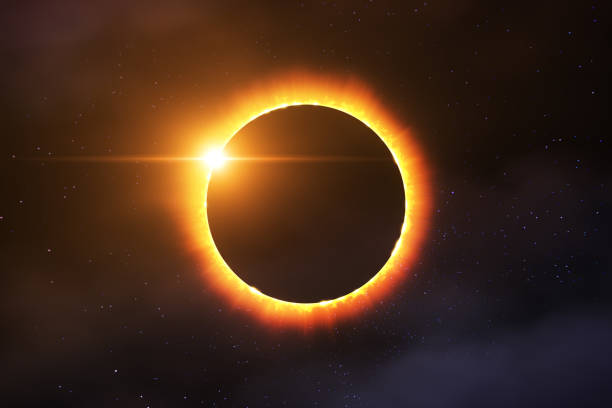 Total Solar Eclipse Picture of a total solar eclipse combined with stars and some clouds. Prefectly usable for all media coverage concerning solar eclipses or astronomy in general. center of the universe stock pictures, royalty-free photos & images