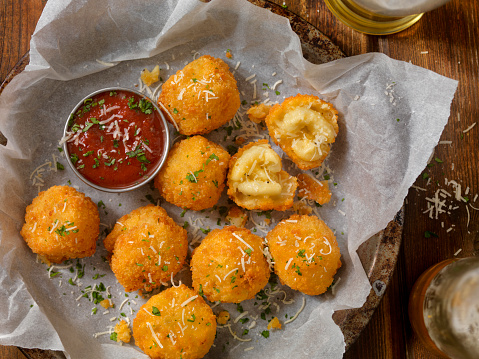 Deep Fried Macaroni and Cheese Balls with a Couple of Beers and Marinara dipping Sauce