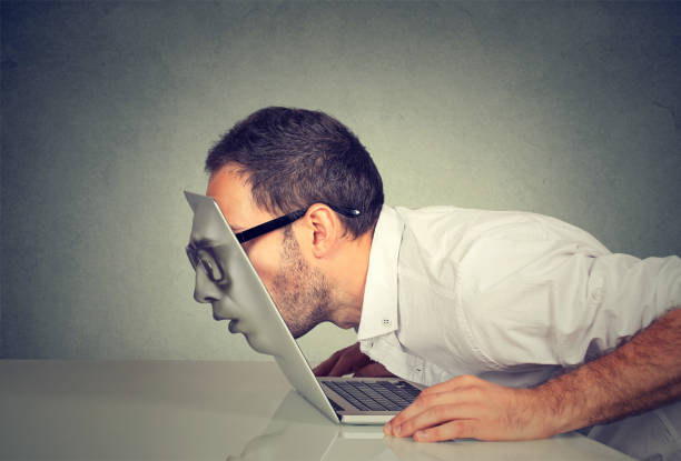 istock Young business man in glasses passing his head through a laptop screen 836005888