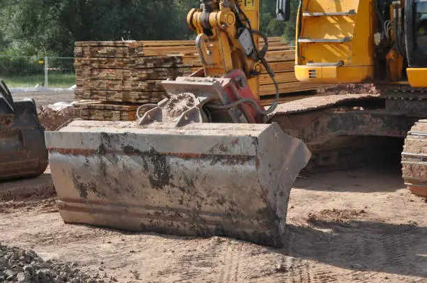 Excavator in the road construction