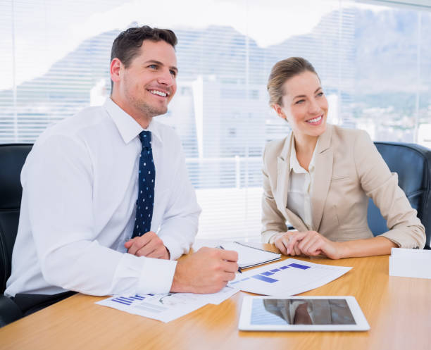 istock Smartly dressed colleagues in business meeting 836011718