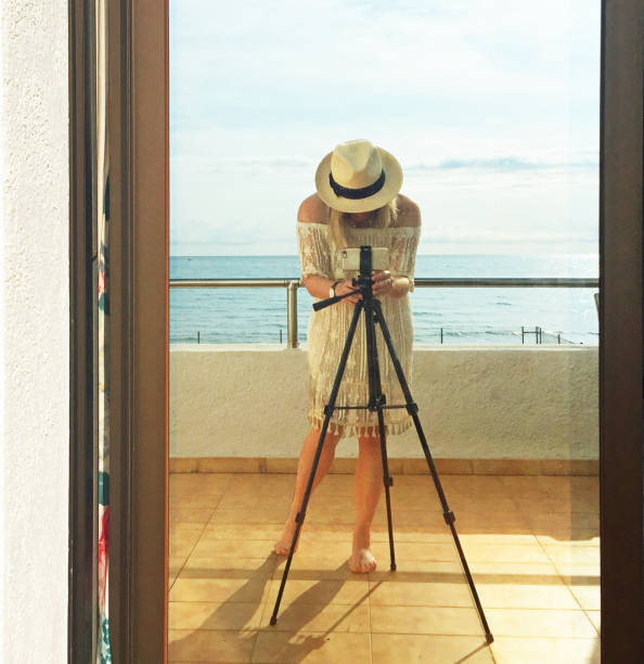 Woman photographer taking shot in Summer