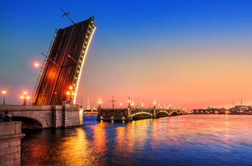 The opened Trinity Bridge across the Neva. White nights in St. Petersburg