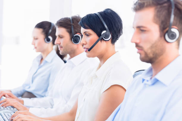 istock Business colleagues with headsets in a row 836041146