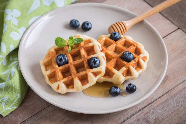 istock Waffle with fresh blueberry and honey on plate 836044046