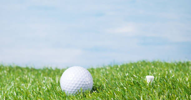 istock Golf ball against the sky and a green lawn 836046972