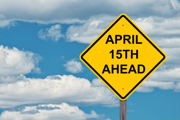 istock Caution Sign Blue Sky Background - April 15th Ahead 836048910