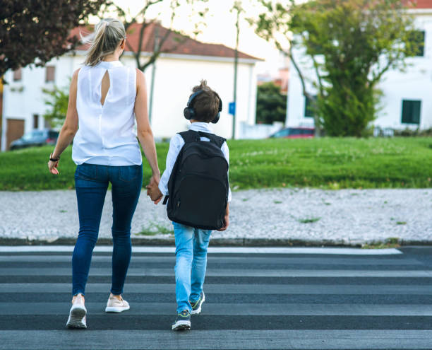 istock Son and Mom crossing the road 836051044