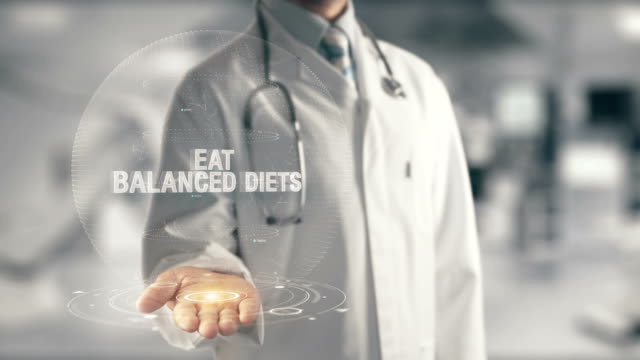 Doctor holding in hand Eat Balanced Diets
