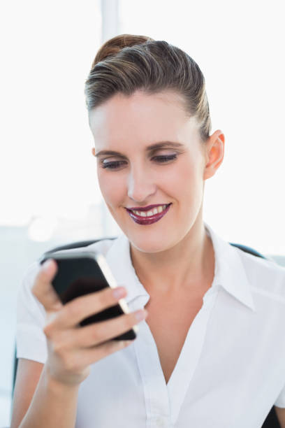 istock Close up view on smiling businesswoman using smartphone 836056274