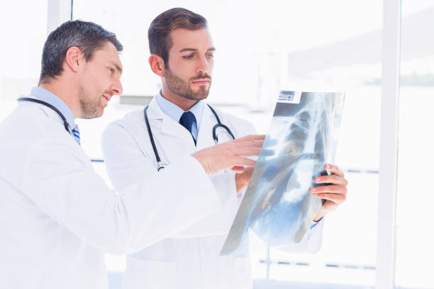 istock Doctors examining xray in medical office 836062752