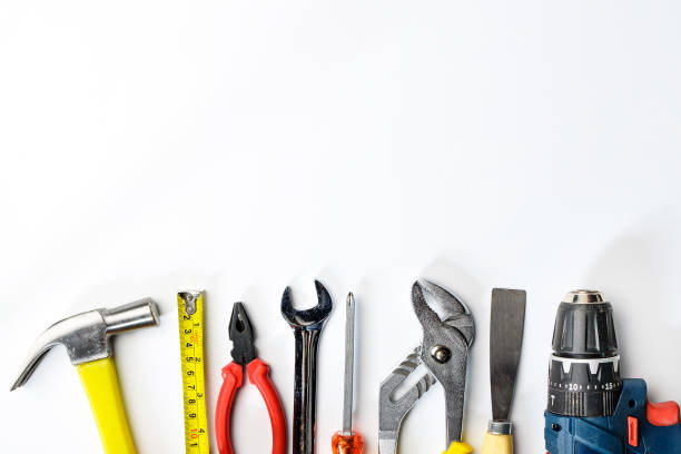 istock Top view of Working tools,wrench,socket wrench,hammer,screwdriver,plier,electric drill,tape measure,machinist square on white background. flat lay design. 836066098
