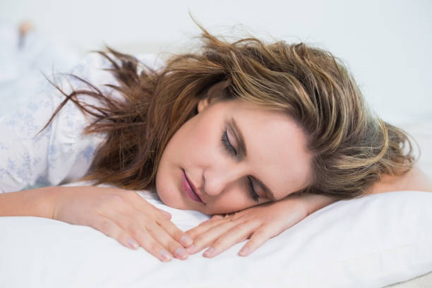 istock Close up view on woman sleeping in cosy bed 836068872