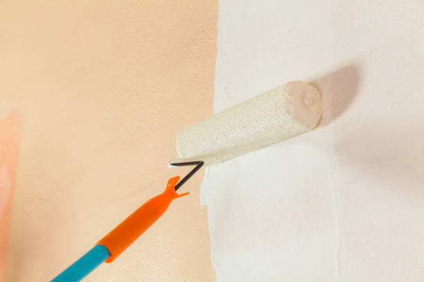 istock Painter painting the walls 836070134