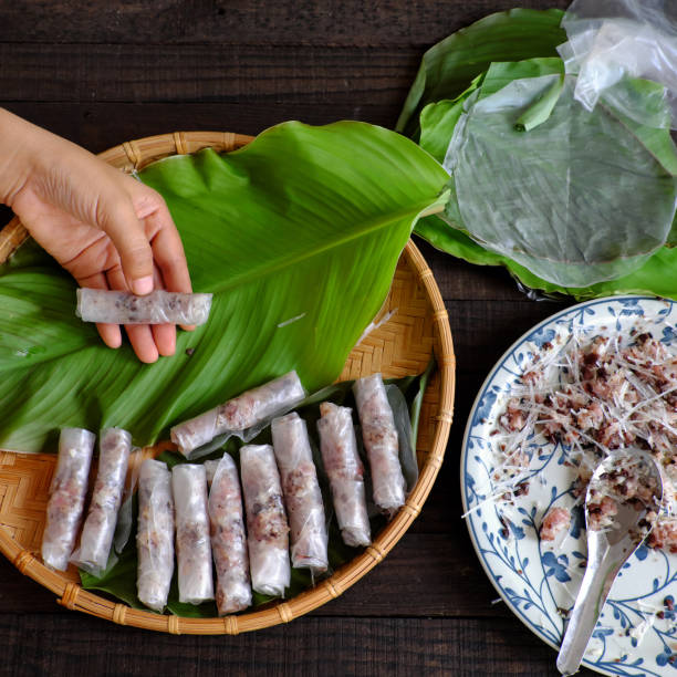 istock Woman making cha gio at home 836070520