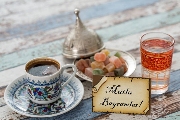 istock Happy eid text in turkish on greeting card with turkish coffee, delights on vintage table 836076530