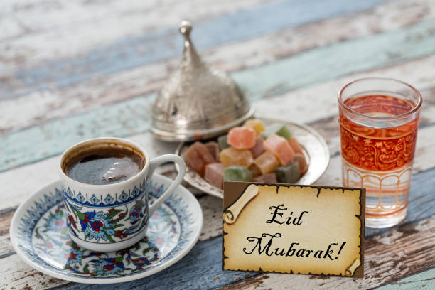 istock Eid mubarak text  on greeting card with turkish coffee, delights on vintage table 836076704