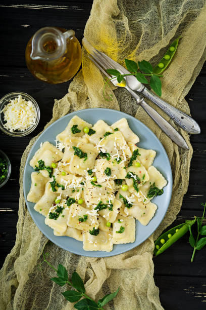 istock Ravioli with ricotta and young green peas. Flat lay. Top view 836077316