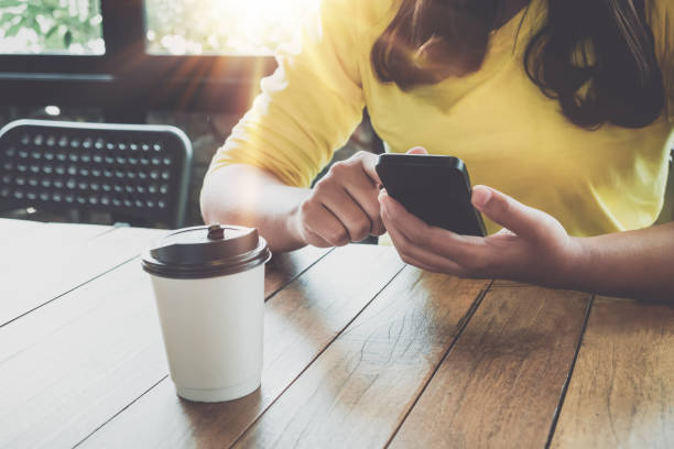 istock young hipster girl using smart phone in cafe 836080674