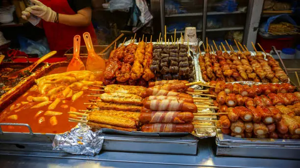 Seoul, Korea street food stall, fish hotdog, soondae other food on stick