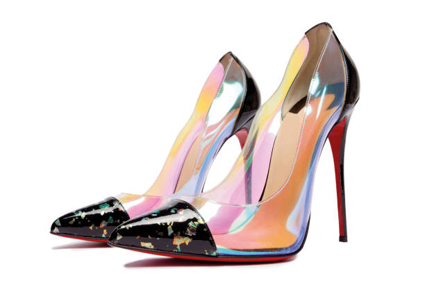 A front view of two pink high heel pumps with bows. Shallow DOF.