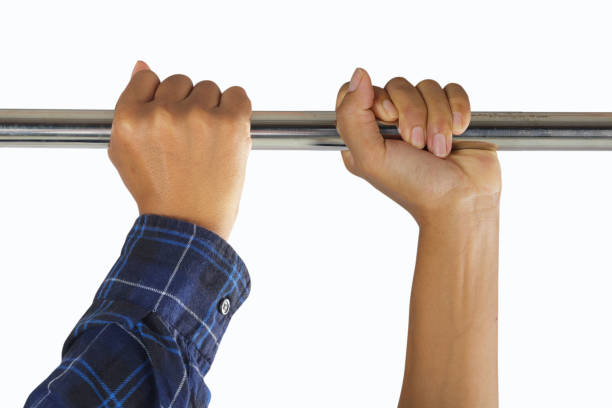 male hands in horizontal bar stock photo