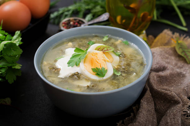 istock Green soup of sorrel in blue bowl. 836084936
