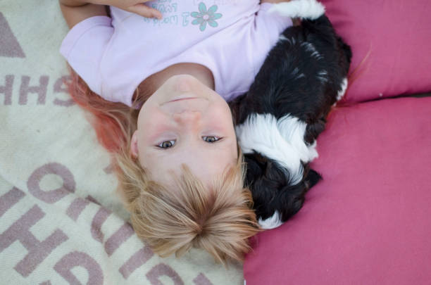 istock Little blond girl looking and smiling at the camera. 836091650