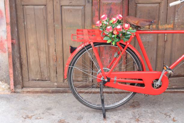 istock flower on saddle red bicycle classic vintage on wall wood background 836091806