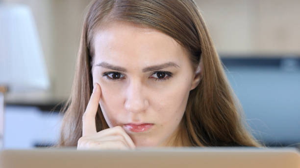 istock Woman Thinking and Working on Laptop 836094448