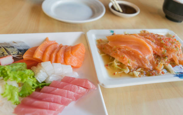 istock salmon fish and other fish raw on table wood 836094718