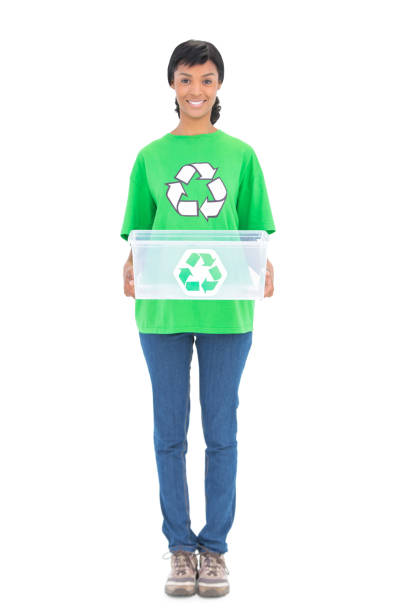 Pleased black haired ecologist holding a recycling box on white background