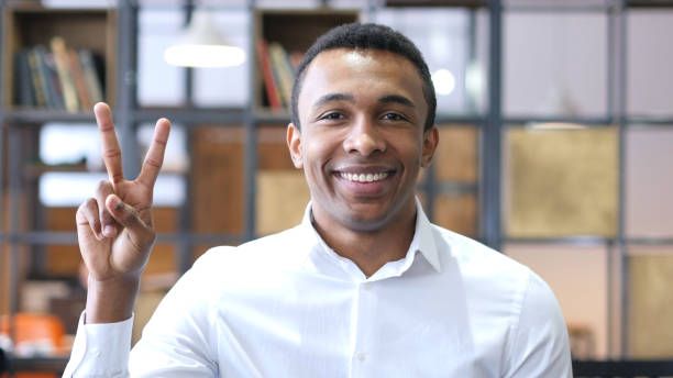 istock Victory Sign by Black Man in Office 836098298