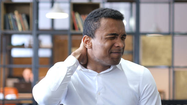 istock Tired Black Man in Office with Neck Pain 836098332