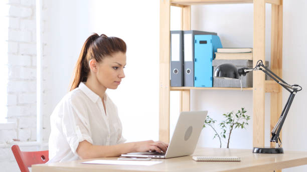 istock Woman Working On Laptop in Office 836098922