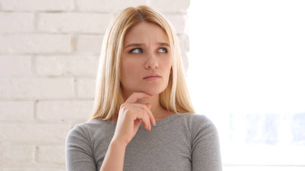 istock Portrait of Thinking Woman Gesturing  Brainstorming 836101462