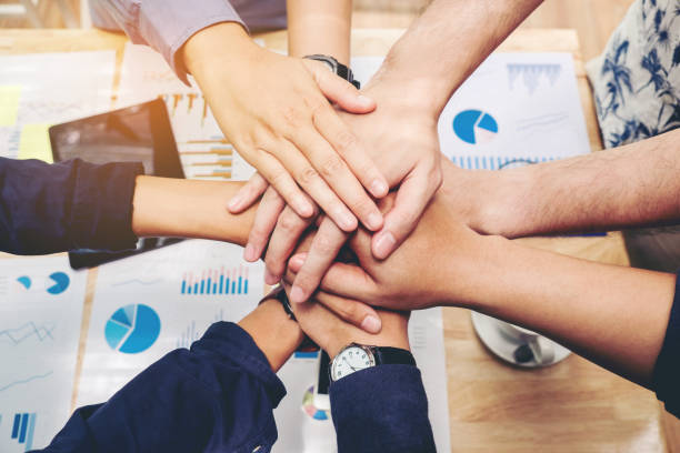 Business Teamwork joining hands team spirit Collaboration Concept Business Teamwork joining hands team spirit Collaboration Concept hands clasped stock pictures, royalty-free photos & images