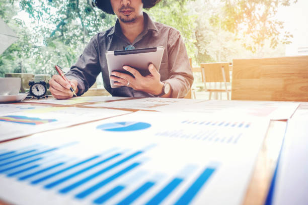 istock Business man Using digital tablet  with Report chart outdoor Cafe 836101688