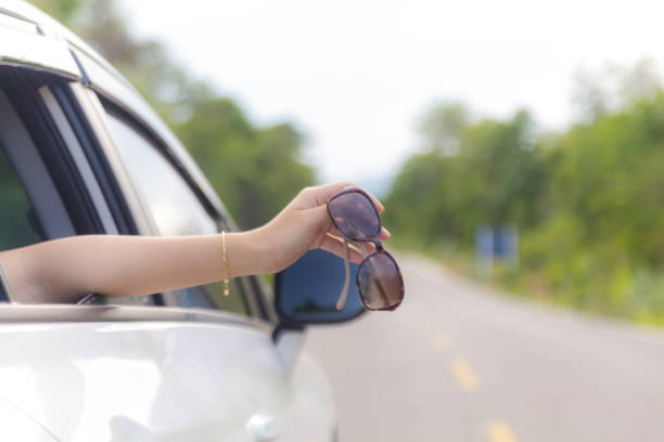 istock Woman hand at the car window 836102412